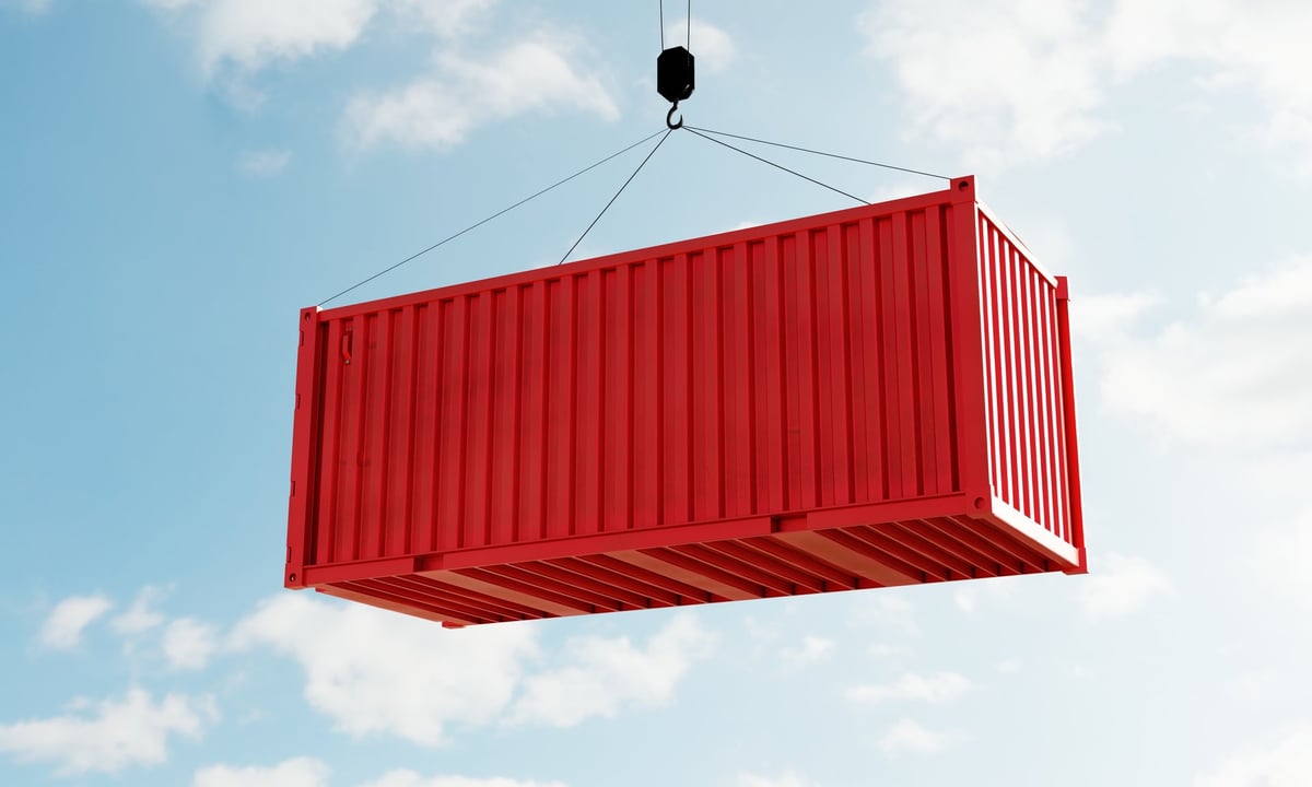Red cargo containers in depot warehouse
