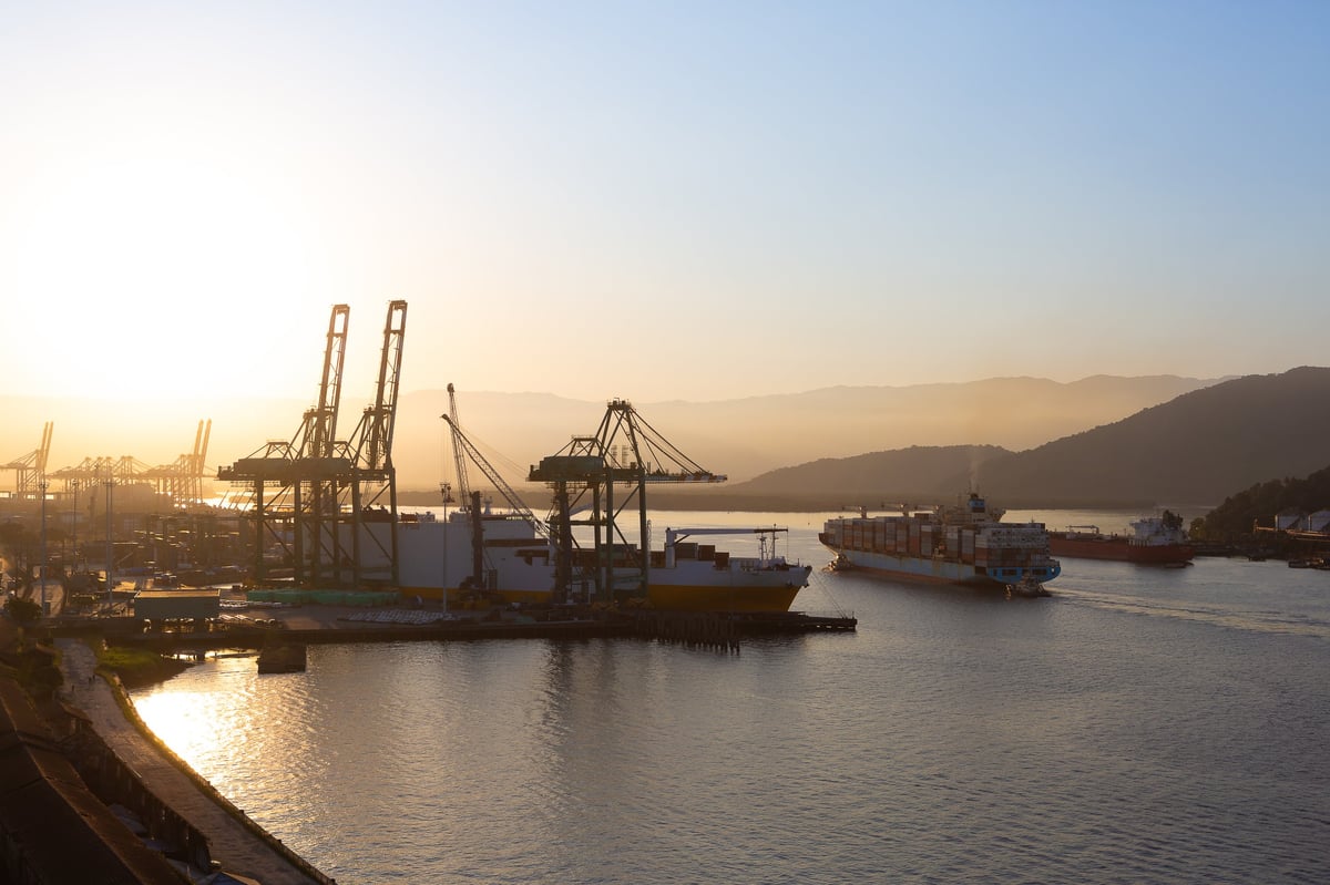 Movement in the port during sunset with ships entering