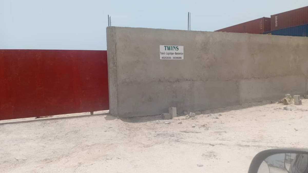 TWINS Transi-Logistique-Manutention sign on the gray wall of the warehousing facility in Nouakchott